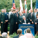 President Bill Clinton signing the NATO Enlargement Act – the White House’s garden, 1998